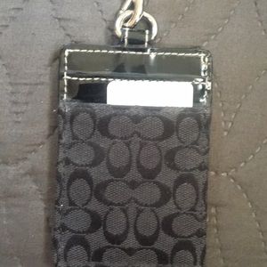 COACH ID holder with leather lanyard.